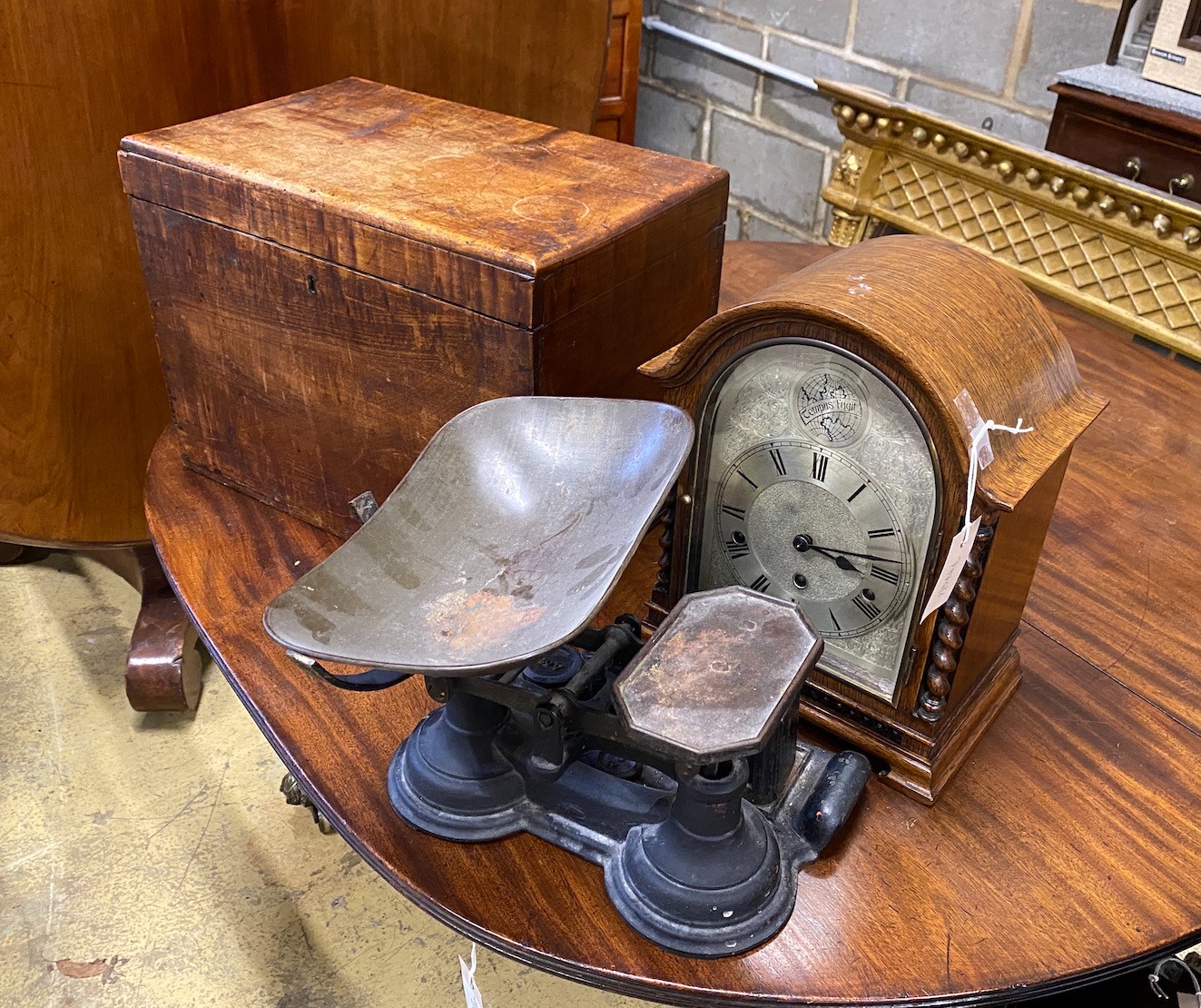 A small Victorian mahogany box, width 43cm, an oak mantel clock and a set of Victorian scales and weights